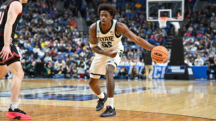 Mar 21, 2026; Buffalo, NY, USA; Michigan State Spartans forward Coen Carr (55) controls the ball in the first half against the Louisville Cardinals during a second round game of the men's 2026 NCAA Tournament at Keybank Center. Mandatory Credit: Mark Konezny-Imagn Images