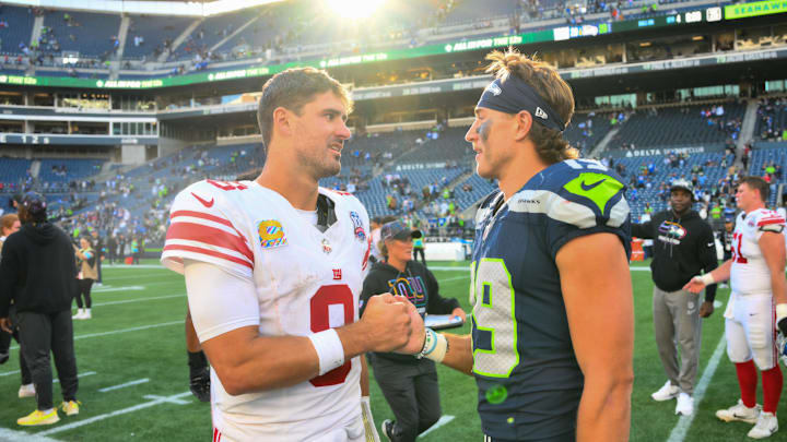 Oct 6, 2024; Seattle, Washington, USA; New York Giants quarterback Daniel Jones (8) and Seattle Seahawks wide receiver Jake Bobo (19) shake hands after the game at Lumen Field. 