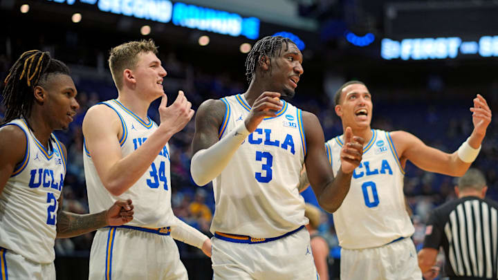 Mar 20, 2025; Lexington, KY, USA;  UCLA Bruins guard Eric Dailey Jr. (3) reacts during the second half against the Utah State Aggies in the first round of the NCAA Tournament at Rupp Arena. Mandatory Credit: Aaron Doster-Imagn Images