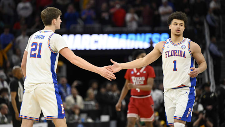 Mar 29, 2025; San Francisco, CA, USA; Florida Gators forward Alex Condon (21) and Florida Gators guard Walter Clayton Jr. (1) high-five during the second half against the Texas Tech Red Raiders during the West Regional final of the 2025 NCAA tournament at Chase Center. Mandatory Credit: Eakin Howard-Imagn Images