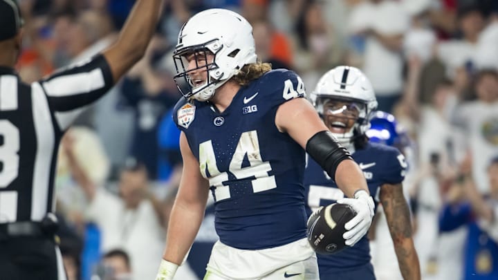 Dec 31, 2024; Glendale, AZ, USA; Penn State Nittany Lions tight end Tyler Warren (44) celebrates after scoring a touchdown against the Boise State Broncos in the Fiesta Bowl at State Farm Stadium. Mandatory Credit: Mark J. Rebilas-Imagn Images Dec 31, 2024; Glendale, AZ, USA; Penn State Nittany Lions tight end Tyler Warren (44) celebrates after scoring a touchdown against the Boise State Broncos in the Fiesta Bowl at State Farm Stadium. Mandatory Credit: Mark J. Rebilas-Imagn Images
