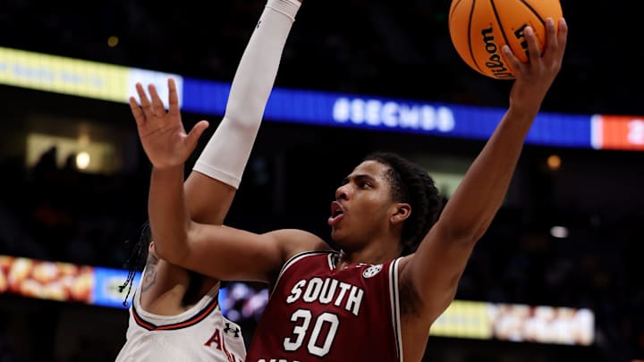 South Carolina Gamecocks forward C (30) attempts a basket while being guarded by Auburn Tigers forward Johni Broome (4) during their quarterfinal game of the SEC Men's Basketball Tournament at Bridgestone Arena in Nashville, Tenn., Friday, March 15, 2024.