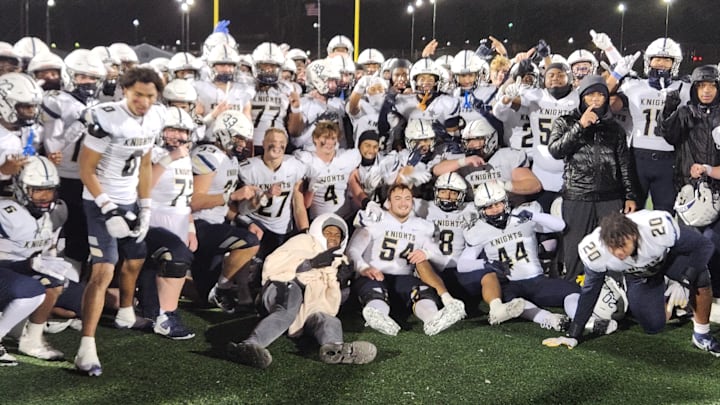 Archbishop Hoban football players celebrate winning the  OHSAA Division II Region 5 championship over Walsh Jesuit on November 22, 2024. 