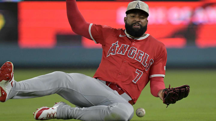 May 16, 2025; Los Angeles, California, USA; Los Angeles Angels right fielder Jo Adell (7) attempts a sliding catch off a pop up by Los Angeles Dodgers catcher Will Smith (16) in the ninth inning at Dodger Stadium. Mandatory Credit: Jayne Kamin-Oncea-Imagn Images May 16, 2025; Los Angeles, California, USA; Los Angeles Angels right fielder Jo Adell (7) attempts a sliding catch off a pop up by Los Angeles Dodgers catcher Will Smith (16) in the ninth inning at Dodger Stadium. Mandatory Credit: Jayne Kamin-Oncea-Imagn Images