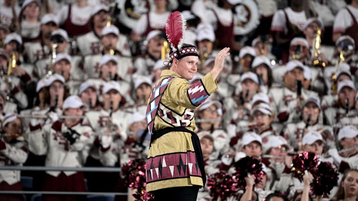 Sep 3, 2023; Orlando, Florida, USA; Florida State Seminoles head drum major John Justice directs the Marching Chiefs during the game against the Louisiana State Tigers at Camping World Stadium. Mandatory Credit: Melina Myers-Imagn Images