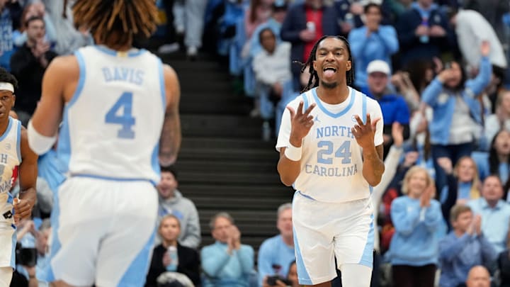 Feb 19, 2025; Chapel Hill, North Carolina, USA; North Carolina Tar Heels forward Jae'Lyn Withers (24) celebrates after guard RJ Davis (4) hits a three point shot in the first half at Dean E. Smith Center. Mandatory Credit: Bob Donnan-Imagn Images
