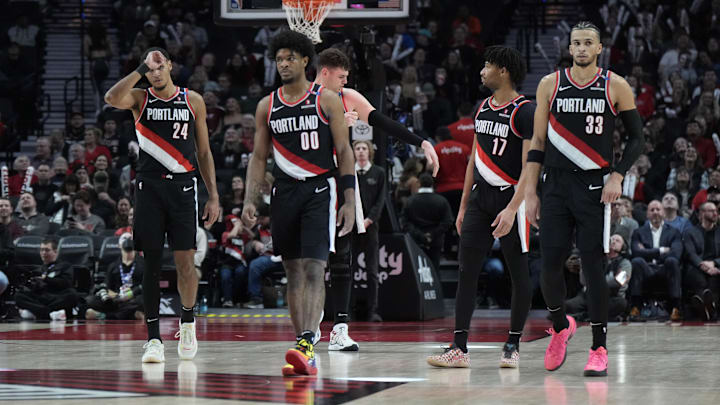 Jan 14, 2025; Portland, Oregon, USA; Portland Trail Blazers (from left to right) Kris Murray (24), Scoot Henderson (00), Donovan Clingan (23),  Shaedon Sharpe (17) and Toumani Camara (33) walk back to the court after a timeout during the second half against the Brooklyn Nets at Moda Center. Mandatory Credit: Soobum Im-Imagn Images
