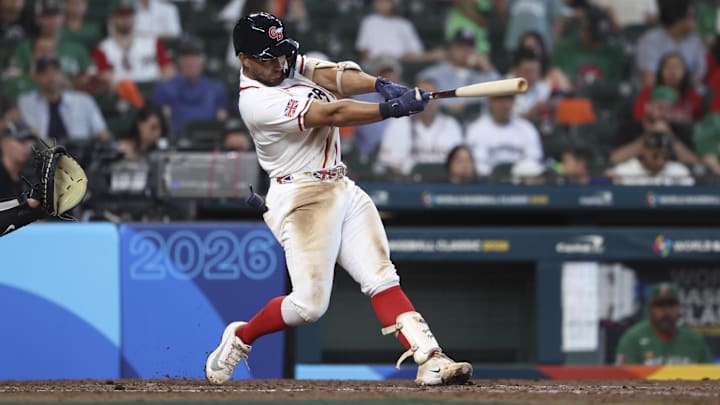 Great Britain catcher Harry Ford (1) hits a home run during the sixth inning against Mexico at Daikin Park. 