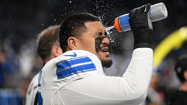 Dec 4, 2025; Detroit, Michigan, USA; Detroit Lions offensive tackle Penei Sewell (58) sprays water on his face before a game against the Dallas Cowboys at Ford Field. Mandatory Credit: Lon Horwedel-Imagn Images