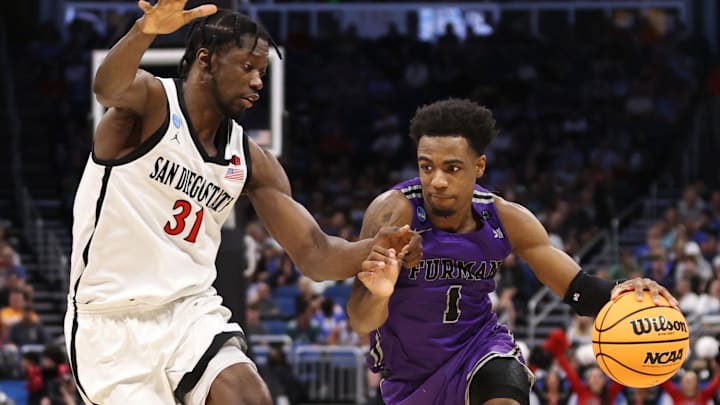 Mar 18, 2023; Orlando, FL, USA; Furman Paladins guard JP Pegues (1) drives against San Diego State