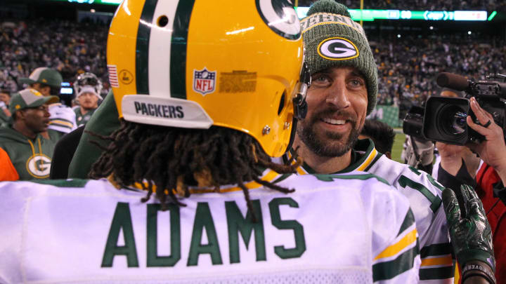 Dec 23, 2018; East Rutherford, NJ, USA; Green Bay Packers quarterback Aaron Rodgers (12) and wide receiver Davante Adams (17) celebrate their victory over the New York Jets in overtime at MetLife Stadium. Mandatory Credit: Ed Mulholland-USA TODAY Sports