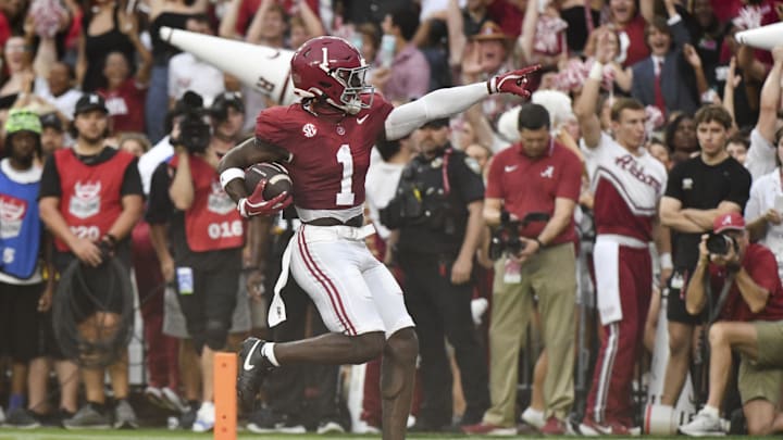 Aug 31, 2024; Tuscaloosa, Alabama, USA;  Alabama Crimson Tide wide receiver Kendrick Law (1) celebrates after scoring a touchdown against the Western Kentucky Hilltoppers during the first half at Bryant-Denny Stadium.  