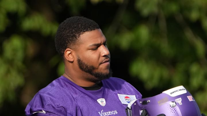 Oct 4, 2024; Watford, United Kingdom; Minnesota Vikings offensive tackle Christian Darrisaw (71) during practice at The Grove. Mandatory Credit: Kirby Lee-Imagn Images