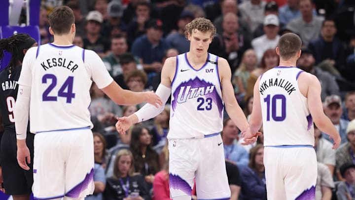 Oct 29, 2025; Salt Lake City, Utah, USA; Utah Jazz forward Lauri Markkanen (23) interacts with center Walker Kessler (24) and guard Svi Mykhailiuk (10) after a basket against the Portland Trail Blazers during the second quarter at Delta Center. Mandatory Credit: Rob Gray-Imagn Images