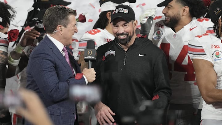 Jan 1, 2025; Pasadena, CA, USA; Ohio State Buckeyes head coach Ryan Day celebrates on the podium after defeating the Oregon Ducks in the 2025 Rose Bowl college football quarterfinal game at Rose Bowl Stadium. Jan 1, 2025; Pasadena, CA, USA; Ohio State Buckeyes head coach Ryan Day celebrates on the podium after defeating the Oregon Ducks in the 2025 Rose Bowl college football quarterfinal game at Rose Bowl Stadium.