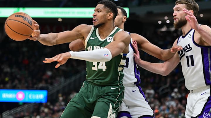 Giannis Antetokounmpo passes the ball