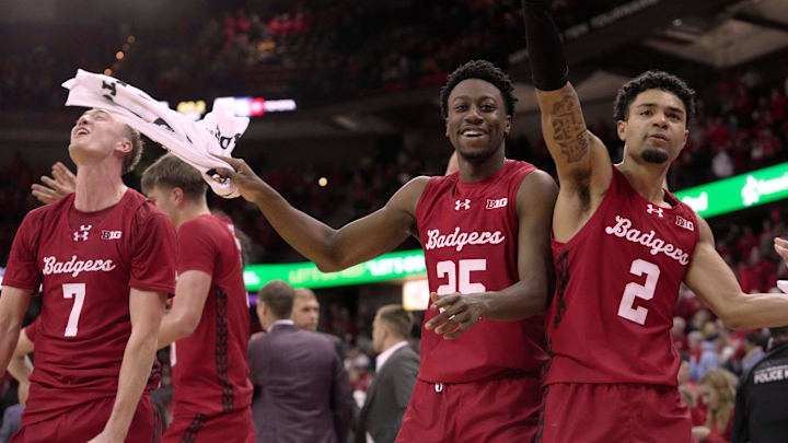 Wisconsin guard John Blackwell (25) and guard Nick Boyd (2) are shown during the waning moment of their game Saturday, December 6, 2025 at the Kohl Center in Madison, Wisconsin. Wisconsin beat Marquette 96-76.