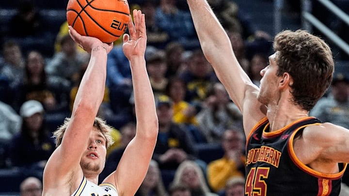Michigan guard Winters Grady (10) makes a jump shot against USC center Gabe Dynes (45) during the second half at Crisler Center in Ann Arbor on Friday, Jan. 2, 2026. Michigan guard Winters Grady (10) makes a jump shot against USC center Gabe Dynes (45) during the second half at Crisler Center in Ann Arbor on Friday, Jan. 2, 2026.