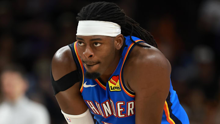 Jan 4, 2026; Phoenix, Arizona, USA; Oklahoma City Thunder guard Luguentz Dort (5) against the Phoenix Suns at Mortgage Matchup Center. Mandatory Credit: Mark J. Rebilas-Imagn Images