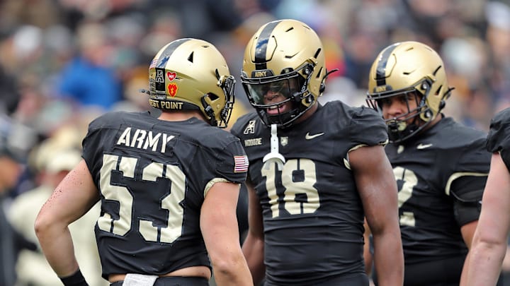 Nov 30, 2024; West Point, New York, USA; Army Black Knights linebacker Elo Modozie (18) celebrates with Army Black Knights linebacker Kalib Fortner (53) after his sack against the UTSA Roadrunners during the first half at Michie Stadium. Mandatory Credit: Danny Wild-Imagn Images