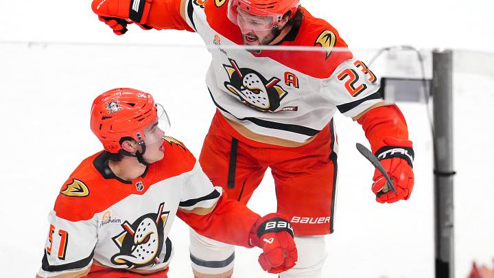 May 12, 2026; Las Vegas, Nevada, USA; Anaheim Ducks defenseman Olen Zellweger (51) celebrates with Anaheim Ducks center Mason McTavish (23) after scoring a goal agianst the Vegas Golden Knights during the third period of game five of the second round of the 2026 Stanley Cup Playoffs at T-Mobile Arena. Mandatory Credit: Stephen R. Sylvanie-Imagn Images