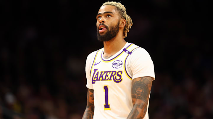 Nov 26, 2024; Phoenix, Arizona, USA; Los Angeles Lakers guard D'Angelo Russell (1) against the Phoenix Suns during an NBA Cup game at Footprint Center. Mandatory Credit: Mark J. Rebilas-Imagn Images