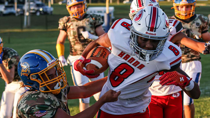 Bryan Mitzel (2) pulls down Lex Cyrus (8) along the near sideline. The Northern Lebanon Vikings played host to the Susquehanna Twp. Indians Friday September 1, 2023. The Indians defeated the Vikings 42-14. Bryan Mitzel (2) pulls down Lex Cyrus (8) along the near sideline. The Northern Lebanon Vikings played host to the Susquehanna Twp. Indians Friday September 1, 2023. The Indians defeated the Vikings 42-14.
