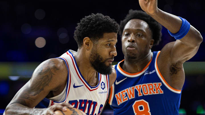 Jan 15, 2025; Philadelphia, Pennsylvania, USA; Philadelphia 76ers forward Paul George (8) drives against New York Knicks forward OG Anunoby (8) during the third quarter at Wells Fargo Center. Mandatory Credit: Bill Streicher-Imagn Images