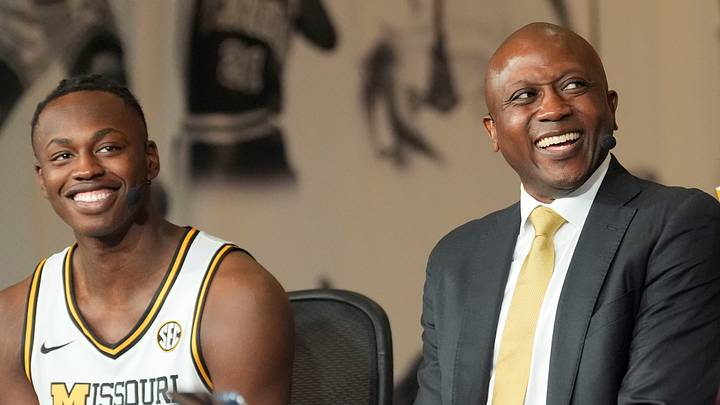 Oct 15, 2025; Birmingham, Alabama, USA; Missouri player Mark Mitchell and head coach Dennis Gates laugh as they are interviewed on TV at SEC Media Day in the Grand Bohemian Hotel. Oct 15, 2025; Birmingham, Alabama, USA; Missouri player Mark Mitchell and head coach Dennis Gates laugh as they are interviewed on TV at SEC Media Day in the Grand Bohemian Hotel.