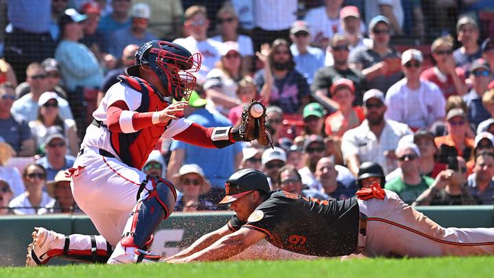 Jun 4, 2026; Boston, Massachusetts, USA; Baltimore Orioles catcher Samuel Basallo (29) scores a run against Boston Red Sox catcher Carlos Narvaez (75) during the fifth inning at Fenway Park. Mandatory Credit: Eric Canha-Imagn Images Jun 4, 2026; Boston, Massachusetts, USA; Baltimore Orioles catcher Samuel Basallo (29) scores a run against Boston Red Sox catcher Carlos Narvaez (75) during the fifth inning at Fenway Park. Mandatory Credit: Eric Canha-Imagn Images