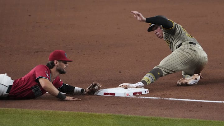 Arizona Diamondbacks shortstop Blaze Alexander (9) forces out San Diego Padres catcher Freddy Fermin (54) at third base during the eighth inning at Chase Field on Aug. 6. Arizona Diamondbacks shortstop Blaze Alexander (9) forces out San Diego Padres catcher Freddy Fermin (54) at third base during the eighth inning at Chase Field on Aug. 6.