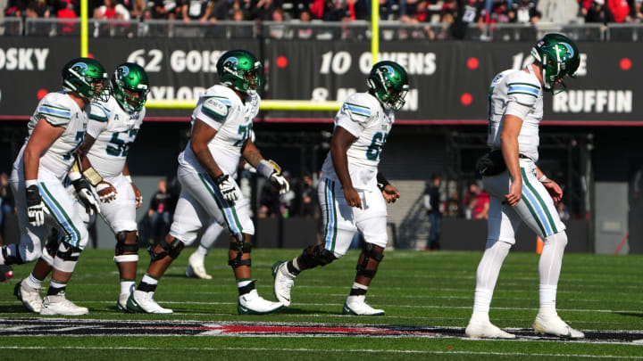 Tulane Green Wave quarterback Michael Pratt (7) and the offensive line walk back to the sideline after a stalled offensive series in the second quarter during a college football game, Friday, Nov. 25, 2022, at Nippert Stadium in Cincinnati.
Ncaaf Tulane Green Wave At Cincinnati Bearcats Nov 25 0107 Tulane Green Wave quarterback Michael Pratt (7) and the offensive line walk back to the sideline after a stalled offensive series in the second quarter during a college football game, Friday, Nov. 25, 2022, at Nippert Stadium in Cincinnati.
Ncaaf Tulane Green Wave At Cincinnati Bearcats Nov 25 0107