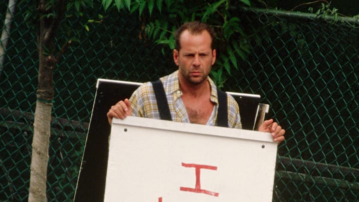 Bruce Willis Holding a Sandwich Board