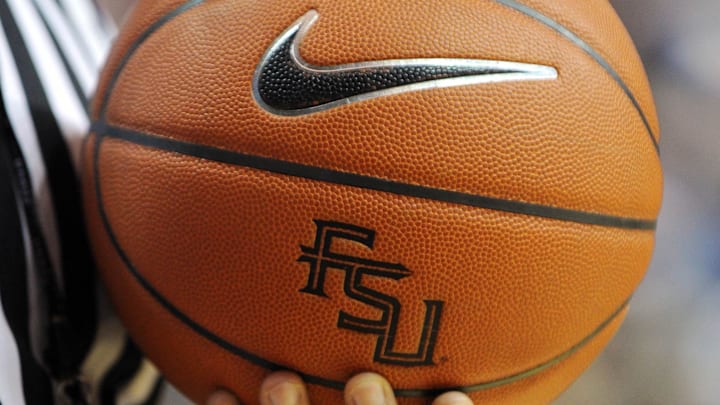 Nov 27, 2012; Tallahassee, FL, USA; An official holds a Florida State Seminoles basketball with logo during the game against the Minnesota Golden Gophers at the Donald L. Tucker Center. Mandatory Credit: Melina Vastola-Imagn Images