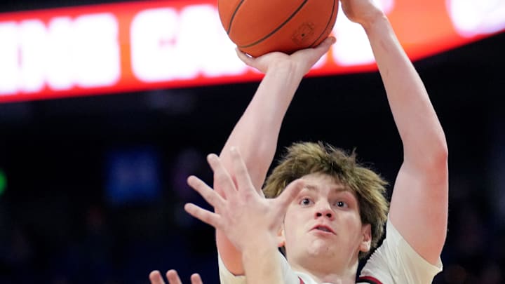 Harlan County Black Bears guard Trent Noah (2) rises for a shot in the first half of a quarterfinal