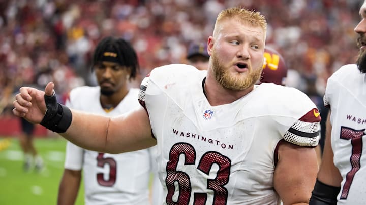 Tyler Biadasz talks to a teammate before game.