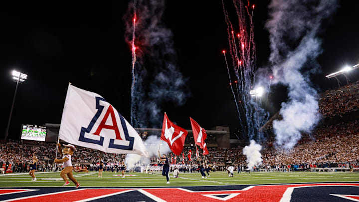 Aug 31, 2024; Tucson, Arizona, USA; Arizona Wildcats mascot Wilbur and Arizona Wildcats cheerleaders lead the Arizona Wildcats football team onto the field at the beginning of the game at Arizona Stadium. Mandatory Credit: Aryanna Frank-Imagn Images