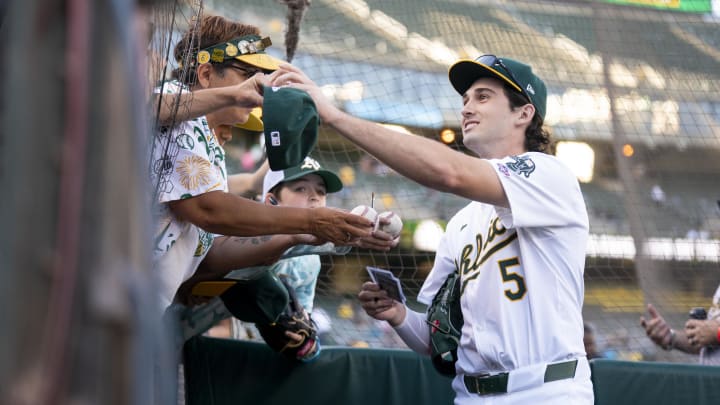 Jul 19, 2024; Oakland, California, USA; Oakland Athletics shortstop Jacob Wilson (5) signs autographs before the start of the game against the Los Angeles Angels at Oakland-Alameda County Coliseum. Mandatory Credit: Cary Edmondson-USA TODAY Sports Jul 19, 2024; Oakland, California, USA; Oakland Athletics shortstop Jacob Wilson (5) signs autographs before the start of the game against the Los Angeles Angels at Oakland-Alameda County Coliseum. Mandatory Credit: Cary Edmondson-USA TODAY Sports