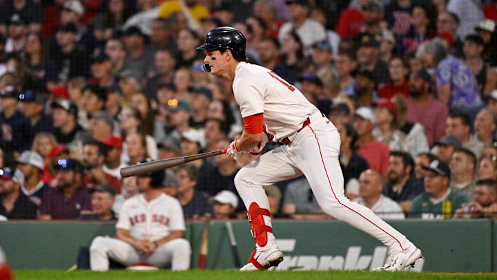 Sep 2, 2025; Boston, Massachusetts, USA;  Boston Red Sox right fielder Roman Anthony (19) hits a one run hits an RBI single against the Cleveland Guardians during the second inning at Fenway Park. Mandatory Credit: Eric Canha-Imagn Images