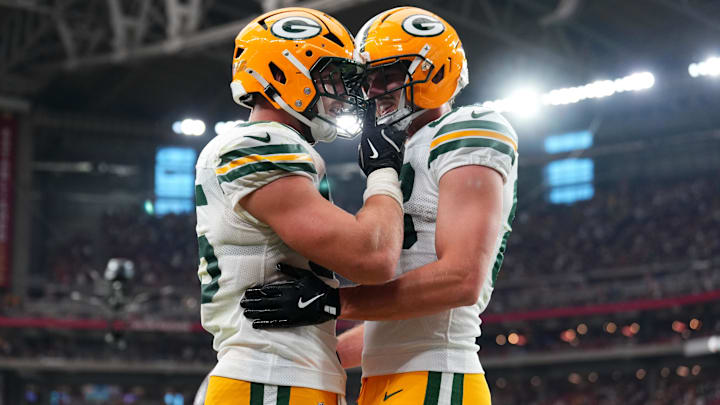 Oct 19, 2025; Glendale, Arizona, USA; Green Bay Packers tight end Tucker Kraft (85) celebrates a touchdown against the Arizona Cardinals with Green Bay Packers tight end Luke Musgrave (88) during the second half against the Arizona Cardinals at State Farm Stadium.