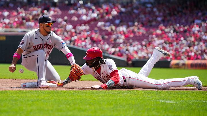 May 10, 2026; Cincinnati, Ohio, USA; Cincinnati Reds shortstop Elly de la Cruz (44) dives back into third base safely against Houston Astros third baseman Isaac Paredes (15) at Great American Ball Park. Mandatory Credit: Aaron Doster-Imagn Images May 10, 2026; Cincinnati, Ohio, USA; Cincinnati Reds shortstop Elly de la Cruz (44) dives back into third base safely against Houston Astros third baseman Isaac Paredes (15) at Great American Ball Park. Mandatory Credit: Aaron Doster-Imagn Images