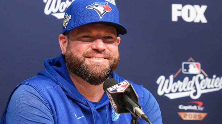 Oct 29, 2025; Los Angeles, California, USA; Toronto Blue Jays manager John Schneider (14) speaks at the pregame press conference before game five of the 2025 MLB World Series at Dodger Stadium. 