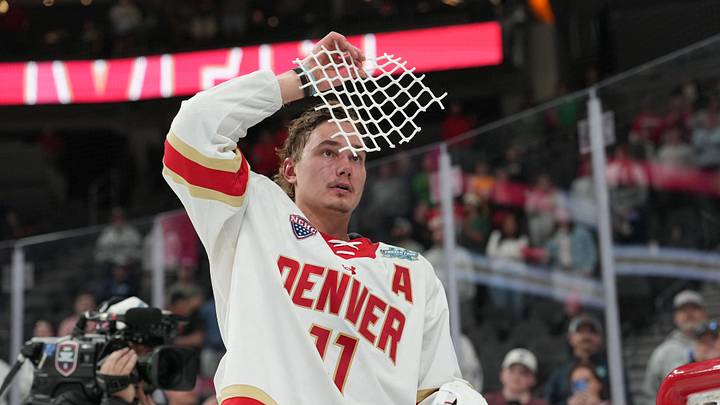 Apr 11, 2026; Las Vegas, Nevada, United States; Denver Pioneers forward Samu Salminen (11) skates with parts of a cut net after defeating the Wisconsin Badgers in the championship game of the NCAA men's ice hockey Frozen Four at T-Mobile Arena. Mandatory Credit: Lucas Peltier-Imagn Images Apr 11, 2026; Las Vegas, Nevada, United States; Denver Pioneers forward Samu Salminen (11) skates with parts of a cut net after defeating the Wisconsin Badgers in the championship game of the NCAA men's ice hockey Frozen Four at T-Mobile Arena. Mandatory Credit: Lucas Peltier-Imagn Images