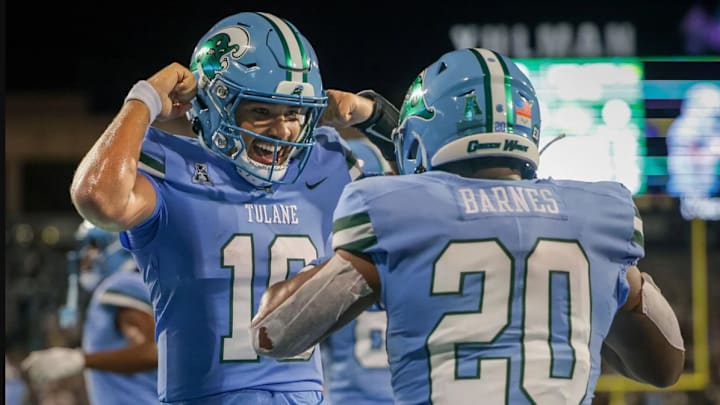 Tulane Green Wave quarterback Darian Mensah (10) celebrates with running back Arnold Barnes III (20) after a touchdown against the Southeastern Louisiana Lions during second half action at Yulman Stadium in New Orleans on Thursday, August 29, 2024.