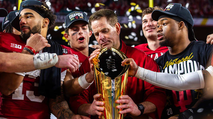 Indiana coach Curt Cignetti prepares to lift the National Championship trophy at Hard Rock Stadium in Miami Gardens on Monday, Jan. 19, 2026.