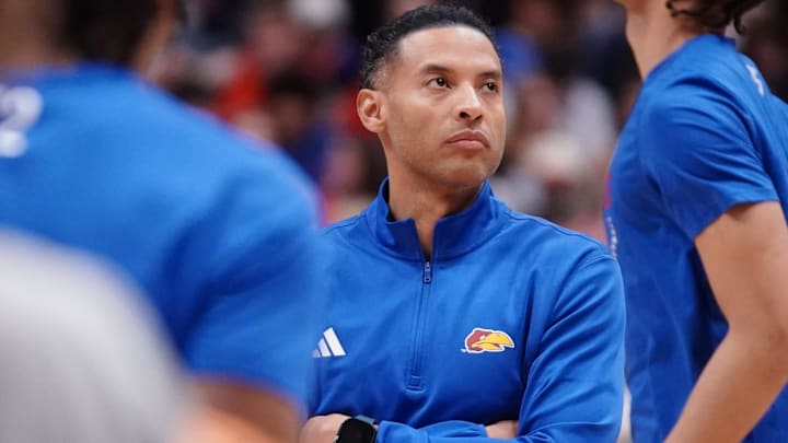 Kansas Jayhawks assistant coach Jeremy Case watches players warm up before taking on Houston Cougars for the game inside Allen Fieldhouse on Monday, Feb. 23, 2026.