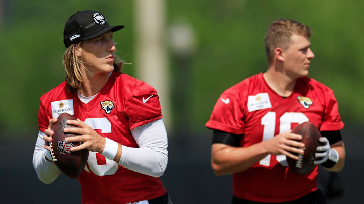 Jacksonville Jaguars quarterback Trevor Lawrence (16) and quarterback Mac Jones (10) look to pass during an organized team activity Tuesday, May 28, 2024 at EverBank Stadium’s Miller Electric Center in Jacksonville, Fla.
