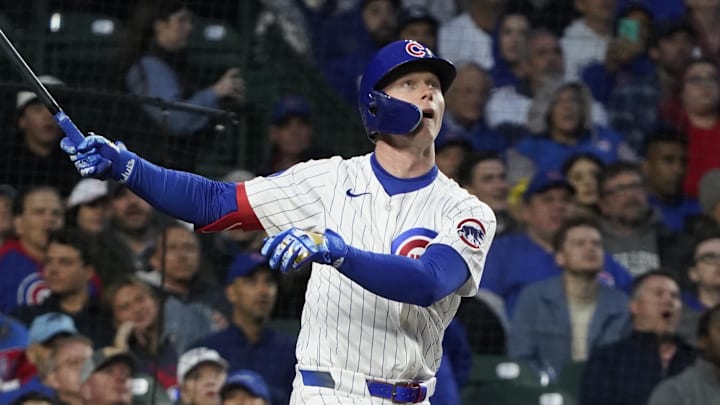 May 28, 2025; Chicago, Illinois, USA; Chicago Cubs outfielder Pete Crow-Armstrong (4) hits a home run against the Colorado Rockies during the fourth inning at Wrigley Field. 