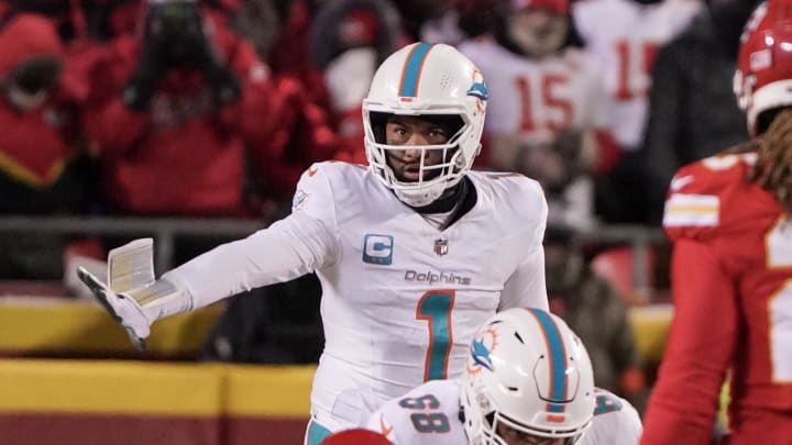 Jan 13, 2024; Kansas City, Missouri, USA; Miami Dolphins quarterback Tua Tagovailoa (1) gestures at the line of scrimmage against the Kansas City Chiefs in a 2024 AFC wild card game at GEHA Field at Arrowhead Stadium. Mandatory Credit: Denny Medley-USA TODAY Sports