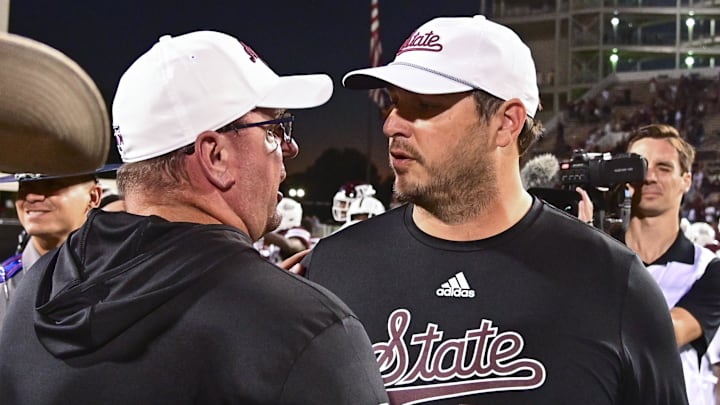 Oct 19, 2024; Starkville, Mississippi, USA; Texas A&M Aggies head coach Mike Elko and Mississippi State Bulldogs head coach Jeff Lebby speak after a game at Davis Wade Stadium at Scott Field. Mandatory Credit: Matt Bush-Imagn Images